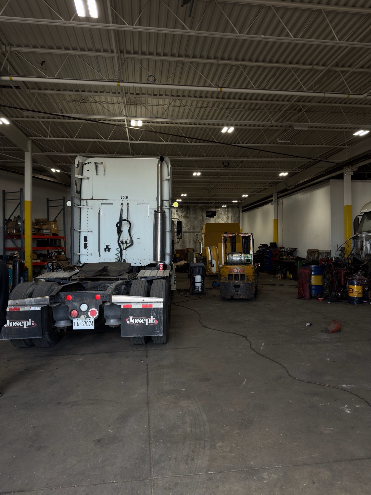 Inside the Planet Truck heavy-duty diesel repair shop floor in Brampton