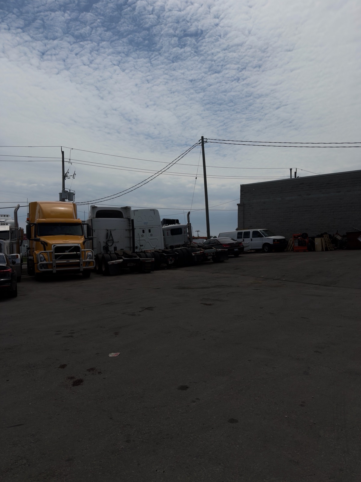 Heavy-duty trucks parked at the Planet Truck and Trailer Repair yard in Brampton